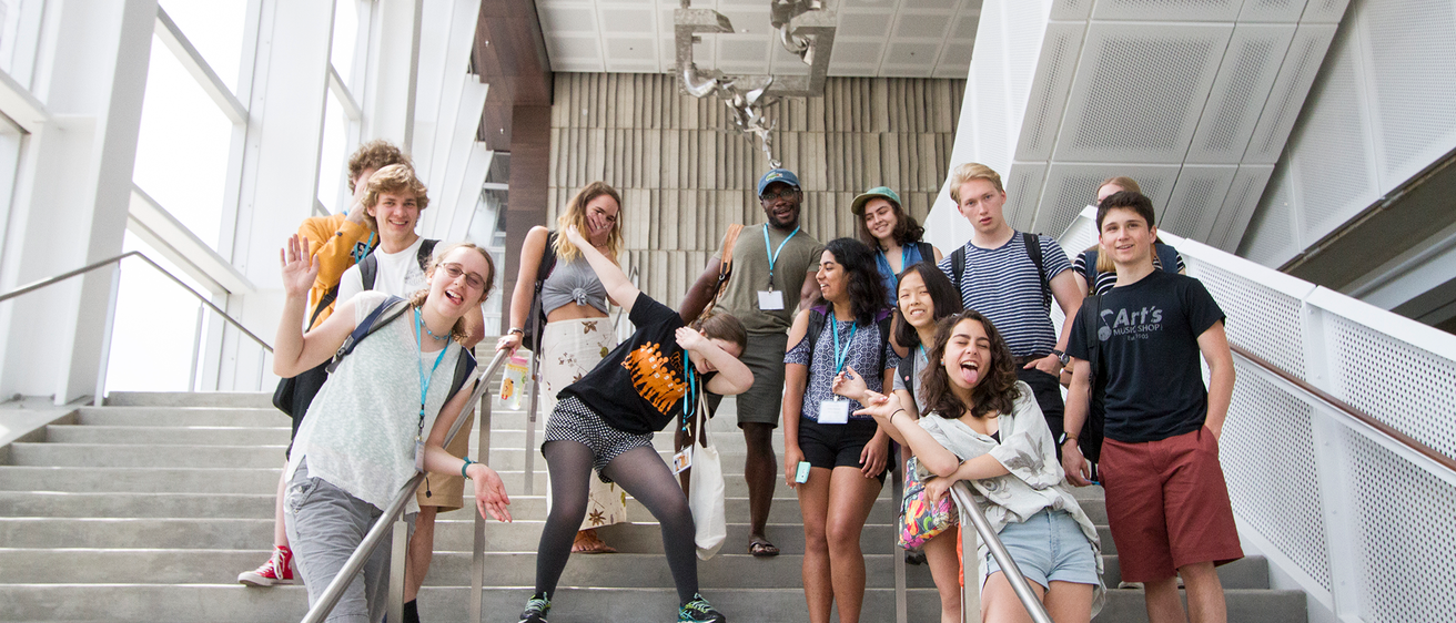 Group photo of students on Voxman interior steps