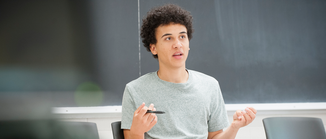 student explaining something in classroom