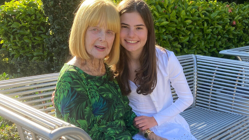 Woman with grandmother embracing
